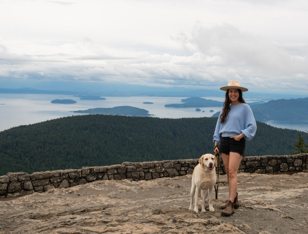 Seattle travel blogger and dog at the top of Mount Constitution Washington